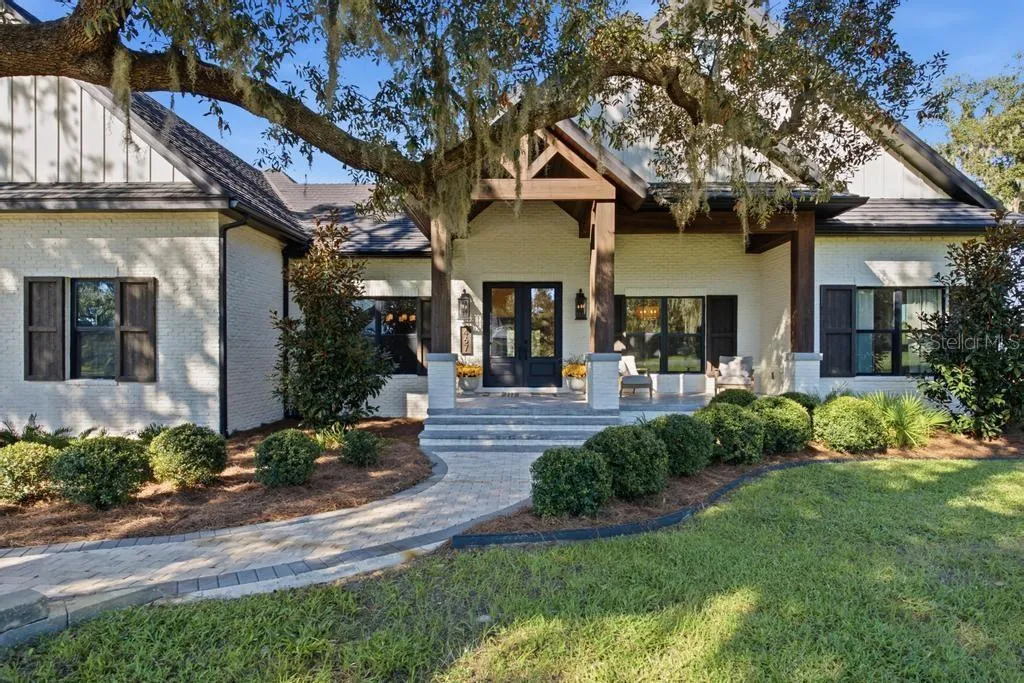 Attractive Entrance with custom laminated post and beams wrapped with rough sawn cypress
