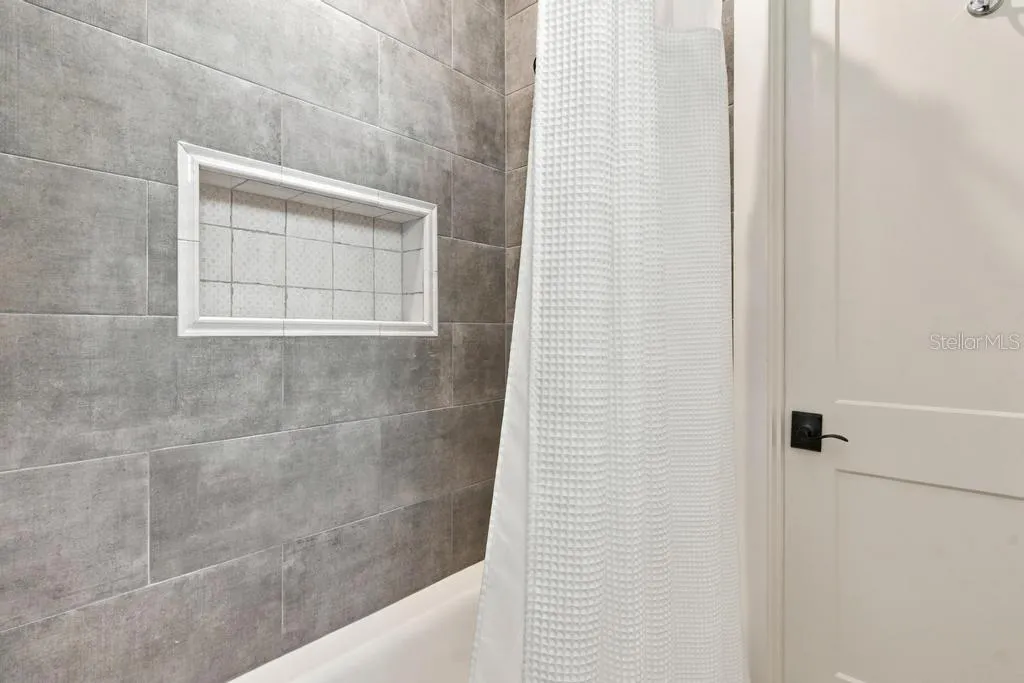 Custom tub/shower in "en-suite" two, leads to walk-in closet