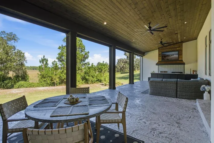 Rear porch with motorized screens