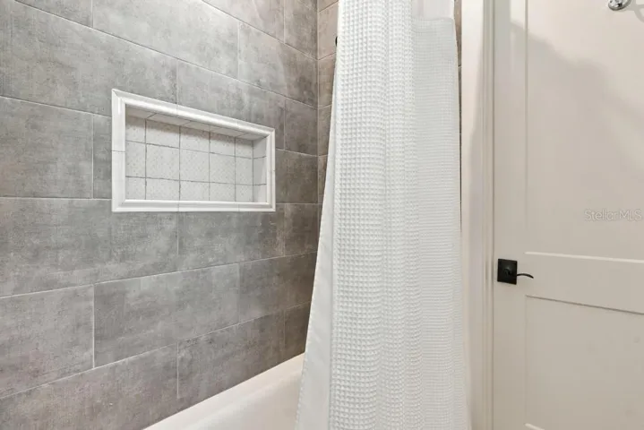 Custom tub/shower in "en-suite" two, leads to walk-in closet
