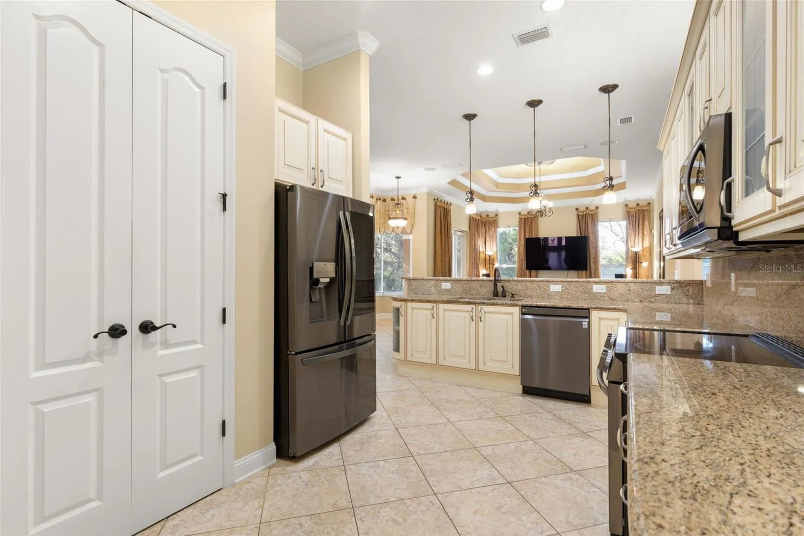 Generous counter space, abundant cabinetry and a well-planned layout make this kitchen as functional as it is beautiful.