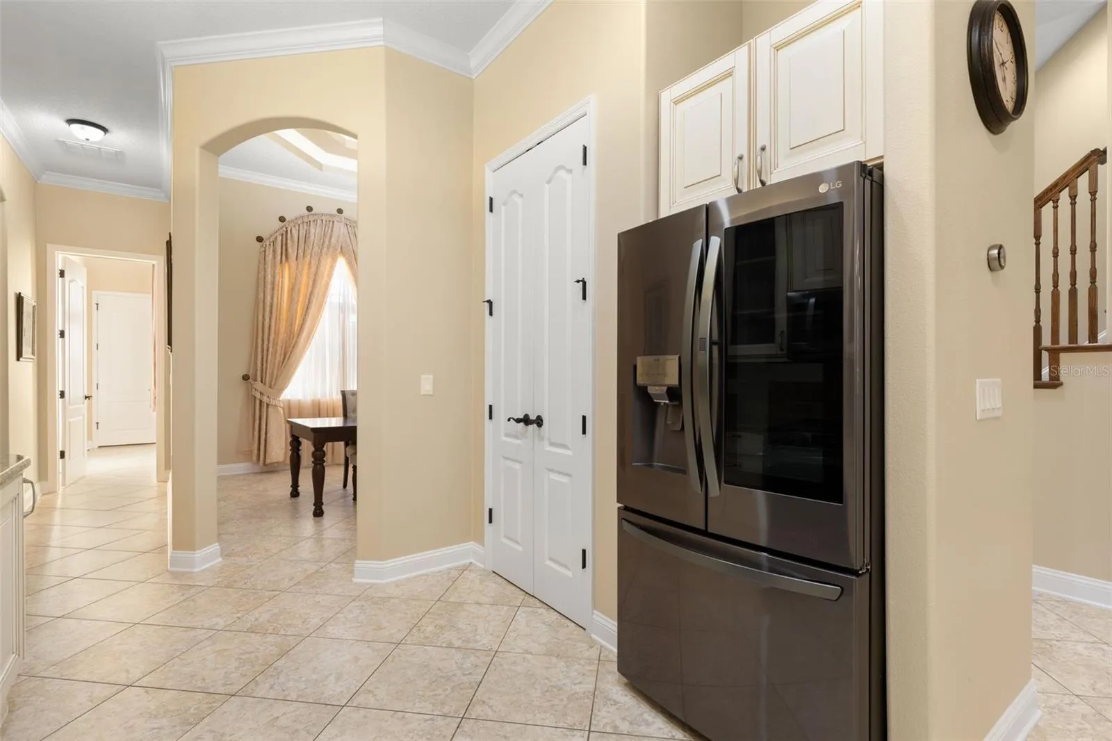 Thoughtfully designed for everyday convenience, the kitchen connects easily to the adjoining dining area.