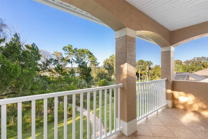 Step onto the private covered balcony and enjoy the peaceful natural surroundings, with glimpses of Emerald Lake through the trees.