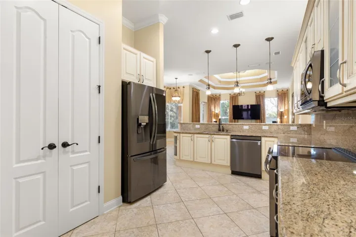Generous counter space, abundant cabinetry and a well-planned layout make this kitchen as functional as it is beautiful.