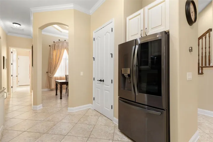 Thoughtfully designed for everyday convenience, the kitchen connects easily to the adjoining dining area.