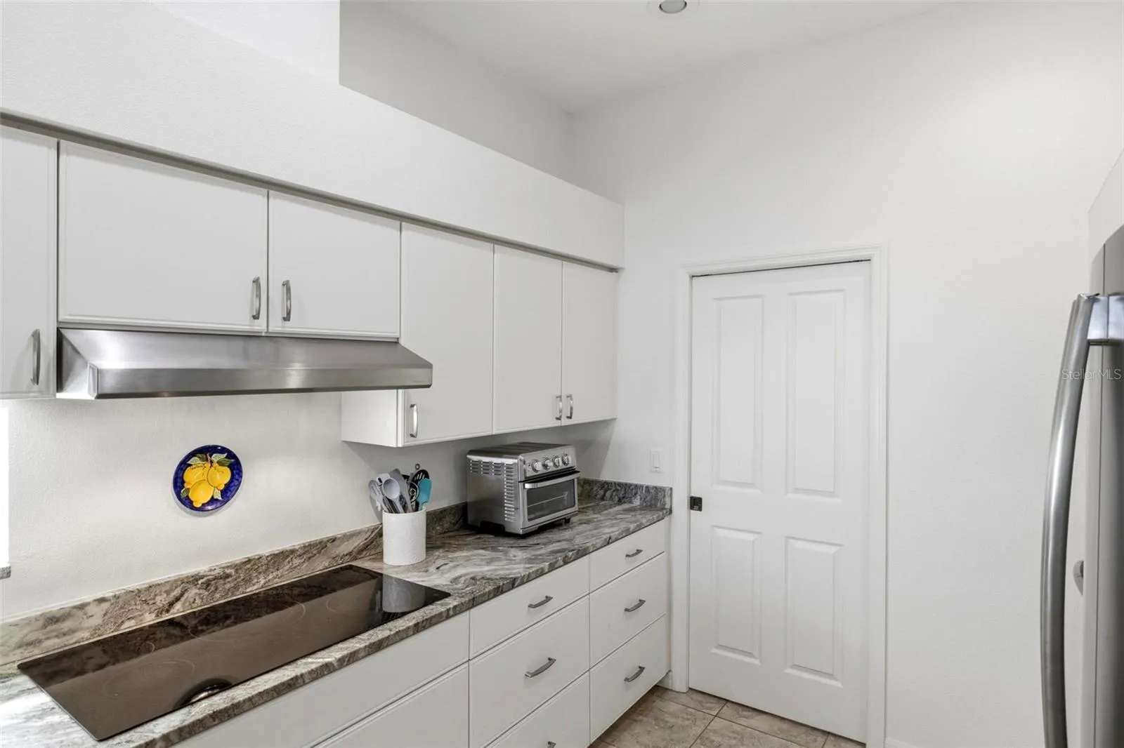 Kitchen with pocket door to laundry room