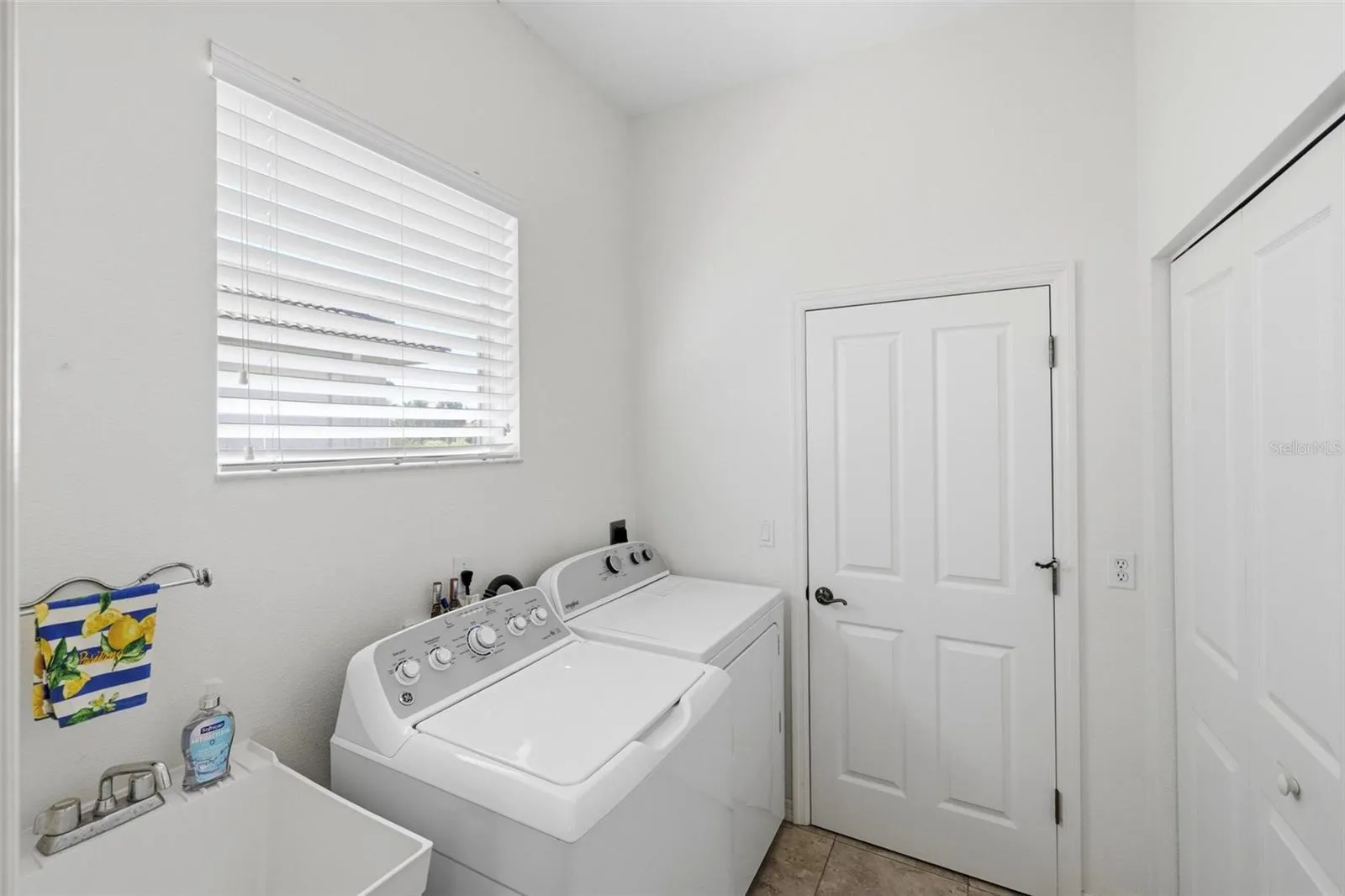 Laundry room with large double closet - pantry/untility