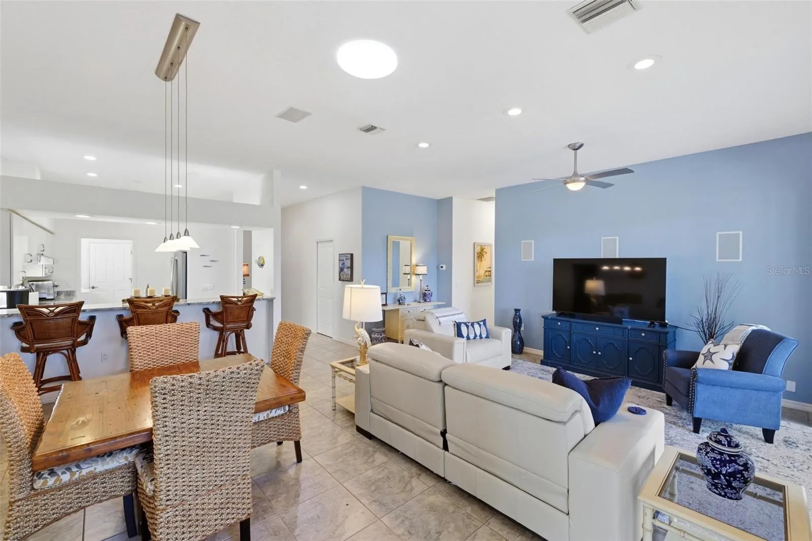 dining/living areas open to breakfast bar/kitchen