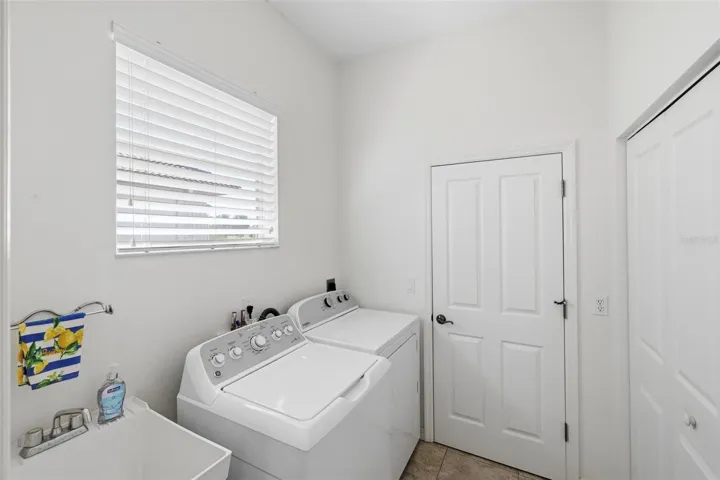 Laundry room with large double closet - pantry/untility