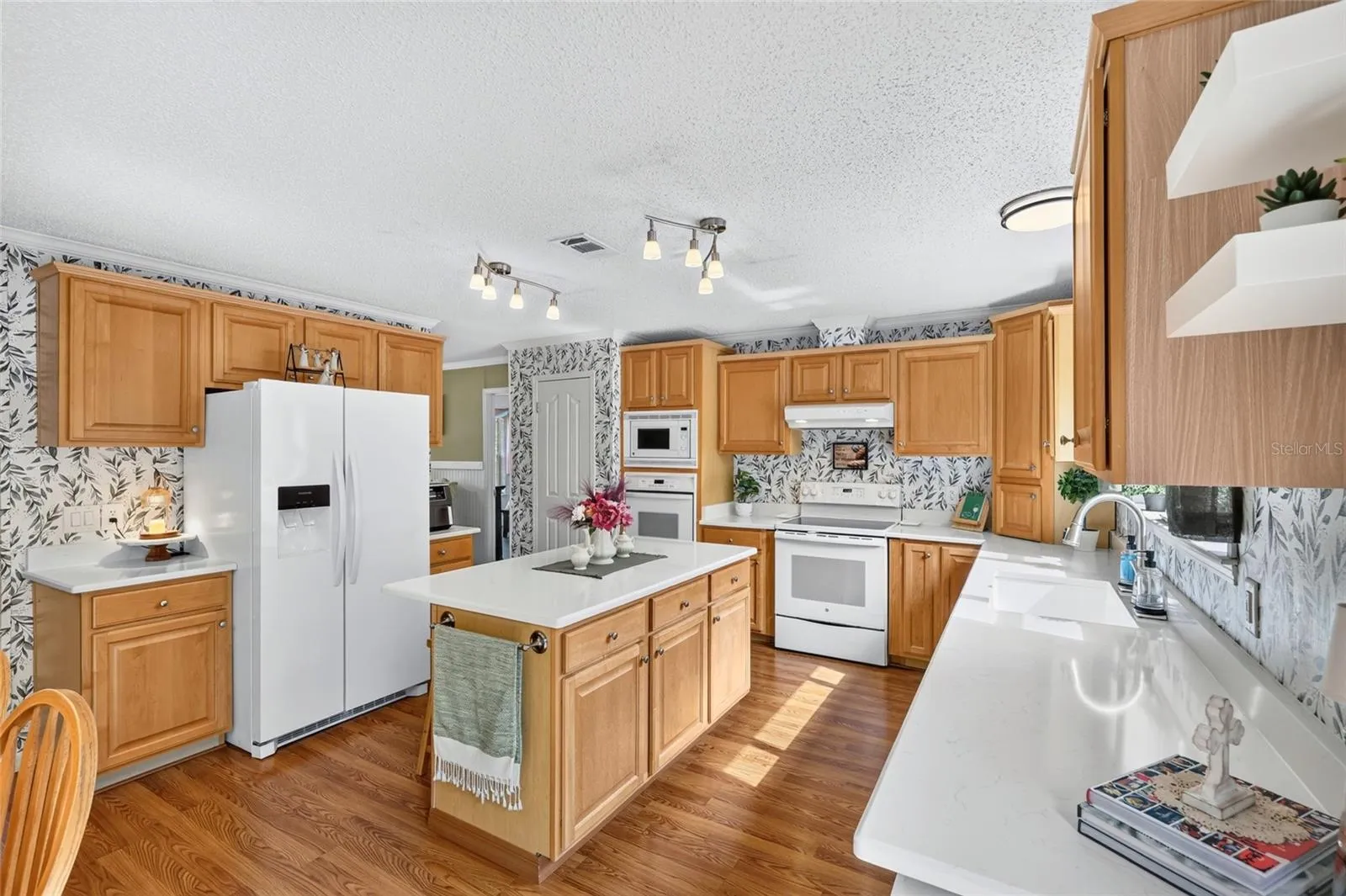 Kitchen with quartz countertops and updated appliances