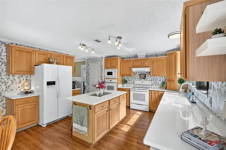 Kitchen with quartz countertops and updated appliances