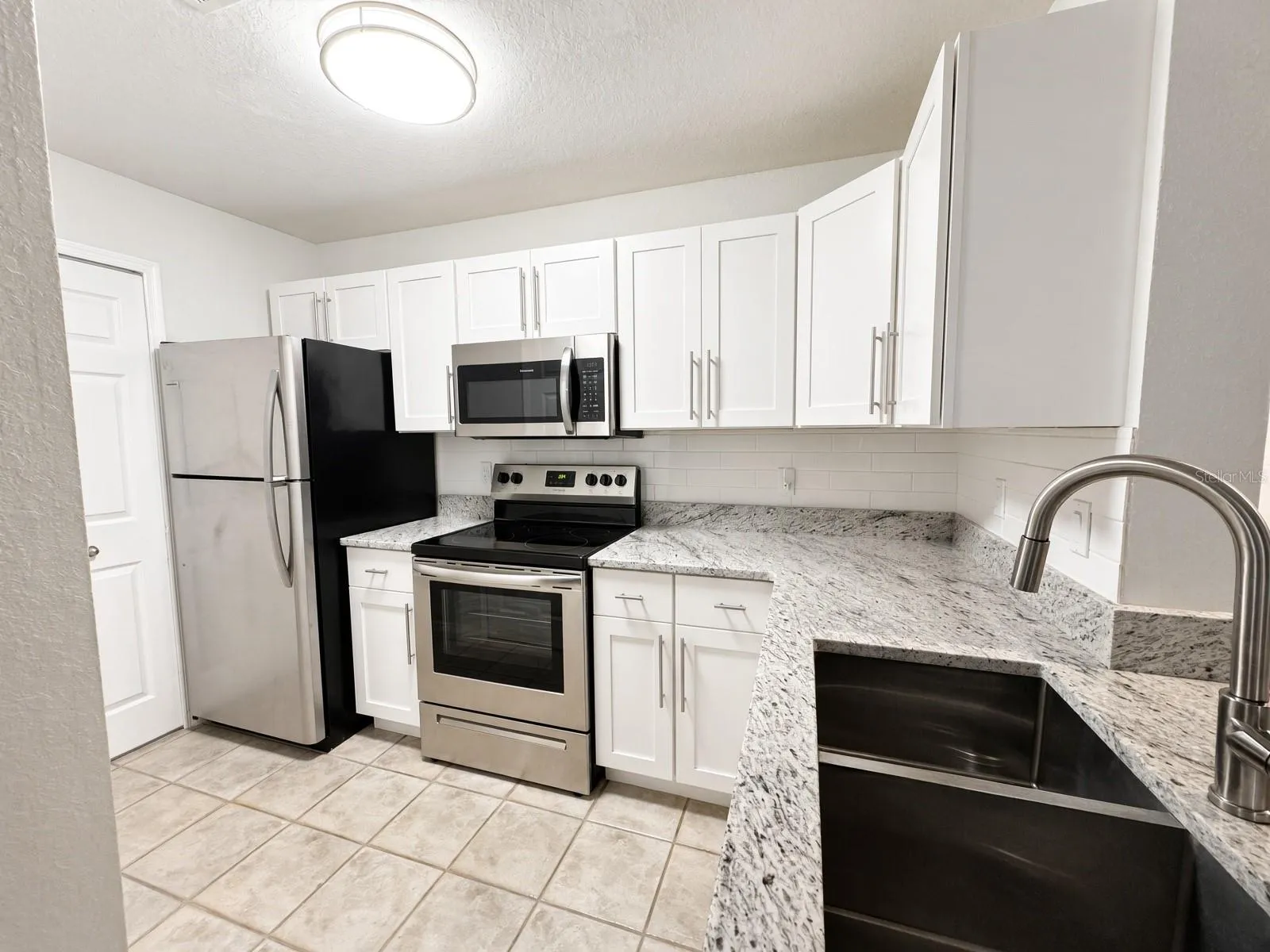 Updated Kitchen including new cabinets and granite countertops