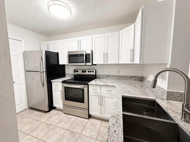 Updated Kitchen including new cabinets and granite countertops