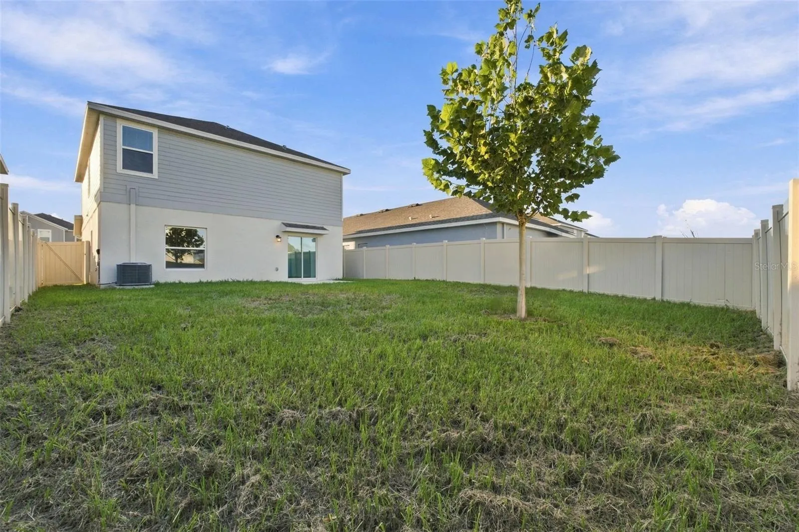 Rear Exterior with Fenced Backyard