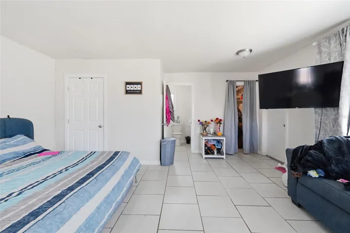 Primary bedroom 2420 with 1/2 bath and laundry