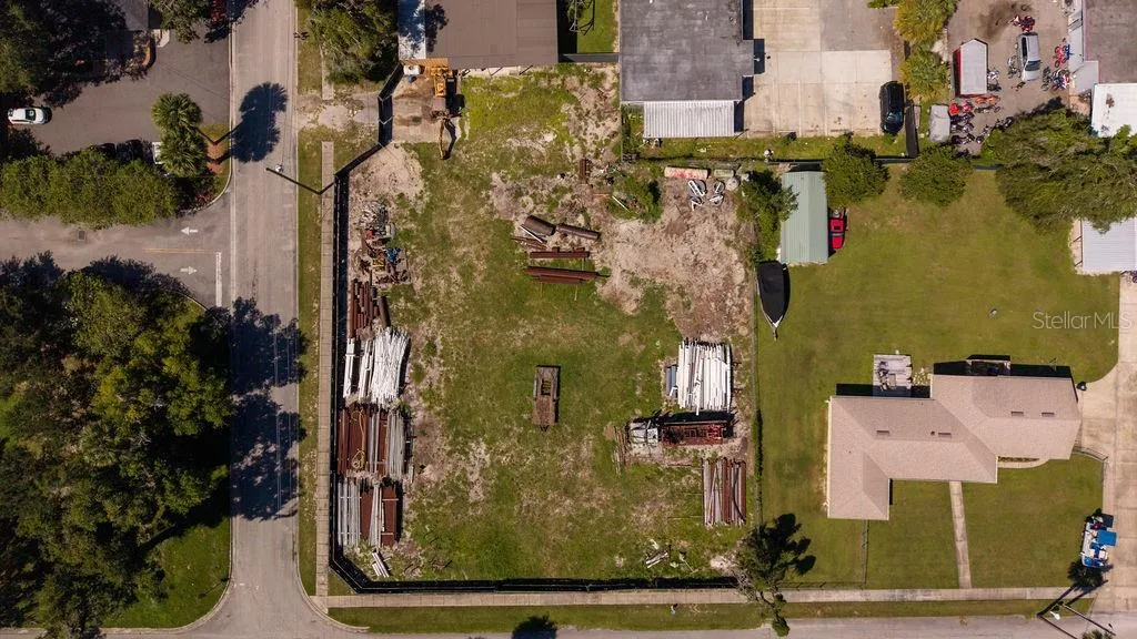 Aerial of vacant lot zoned B4 with frontage on Voorhis to the South and Dexter to the East