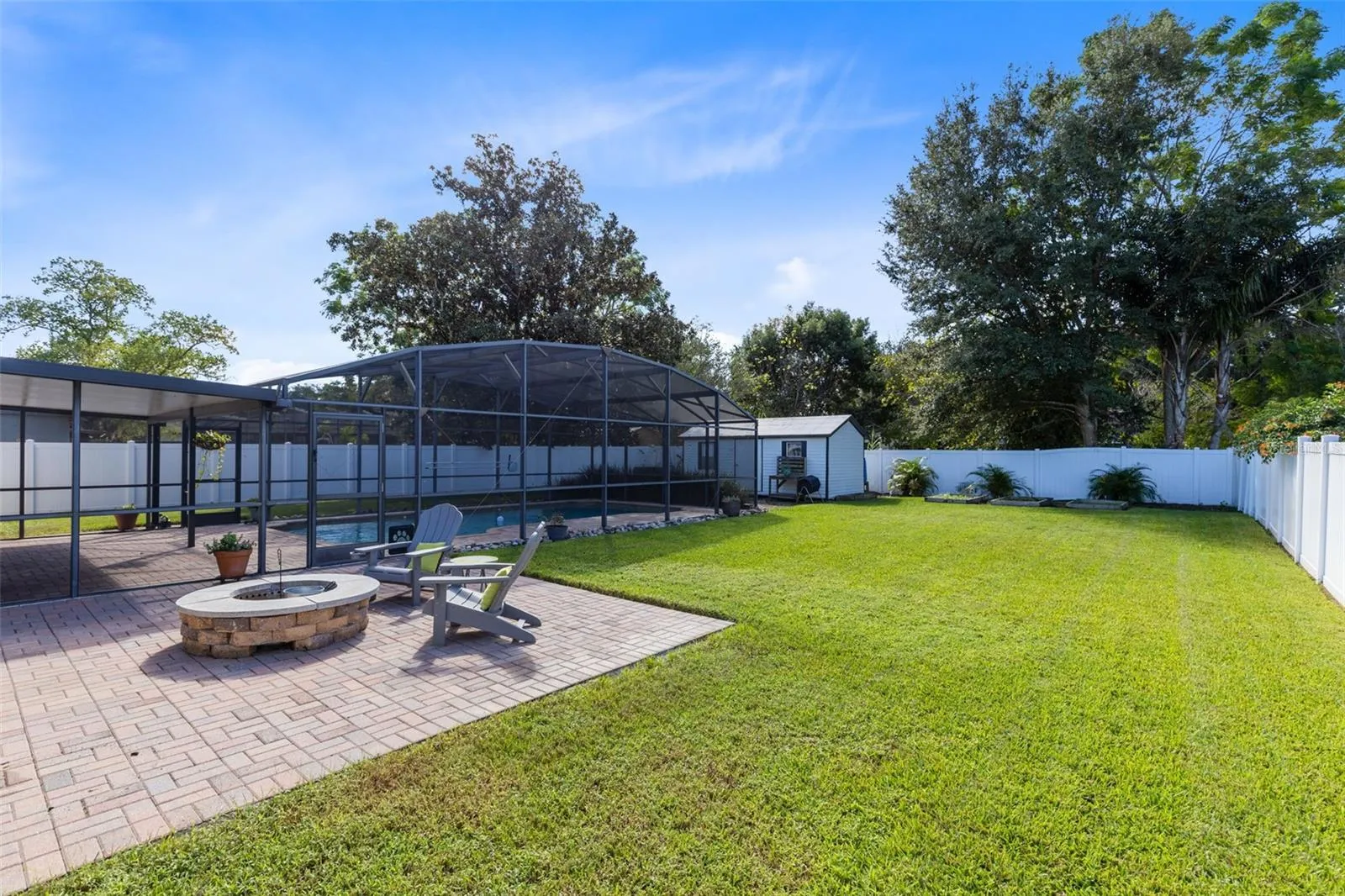 Lush backyard with firepit...Enjoy!