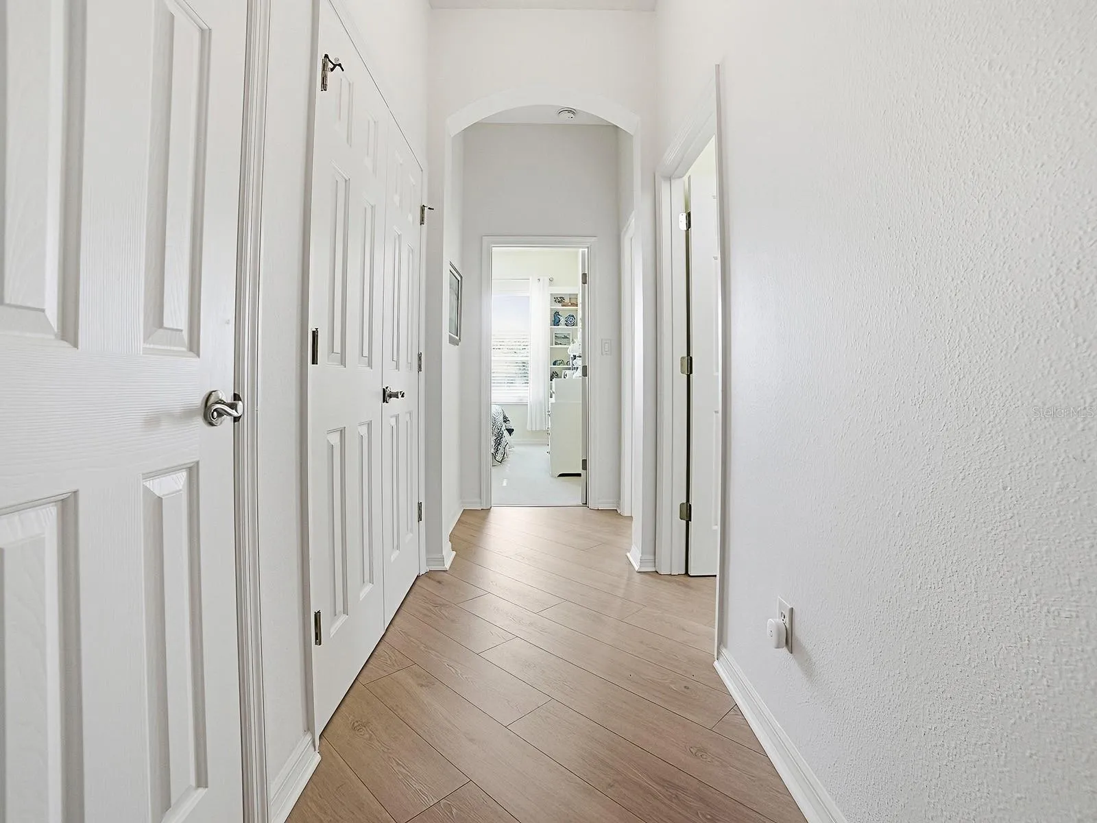 Hallway to the 2 Guest Rooms PLUS a double closet and Another Closet