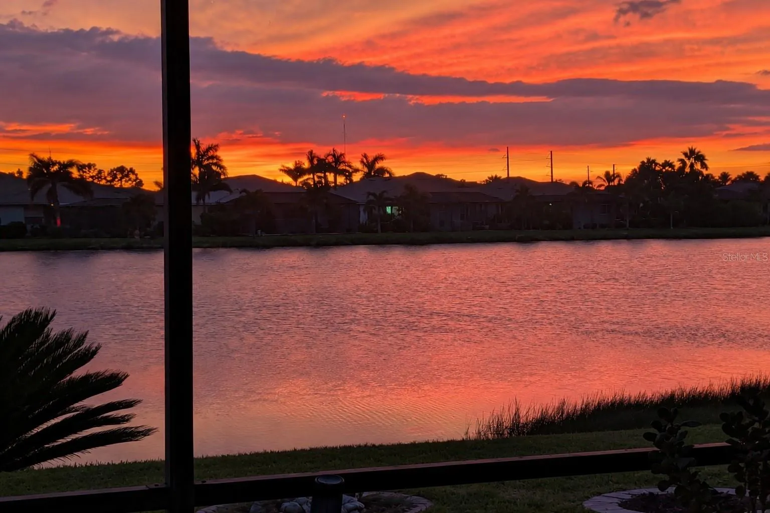 Spectacular sunset views over the lake from your screened lanai.