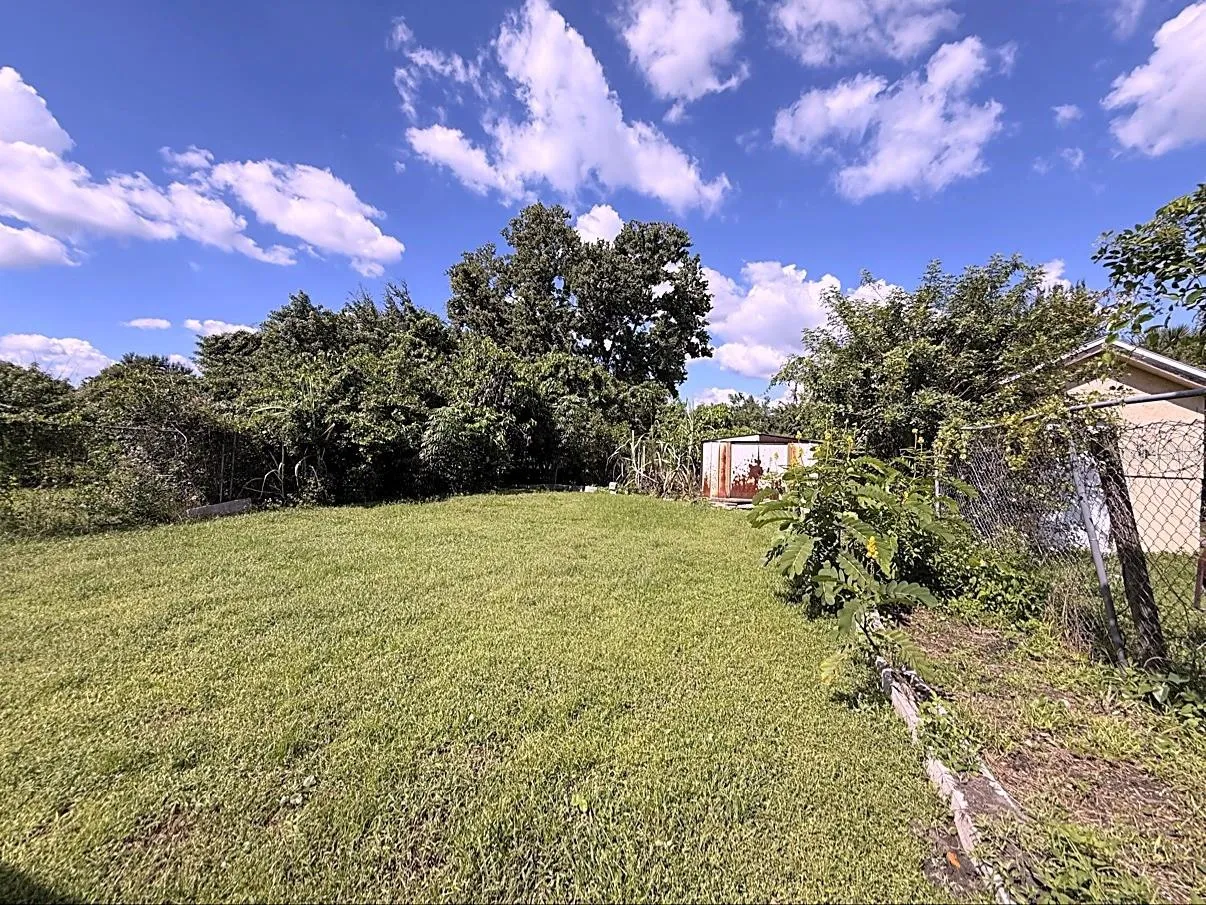 LARGE FENCED IN BACKYARD
