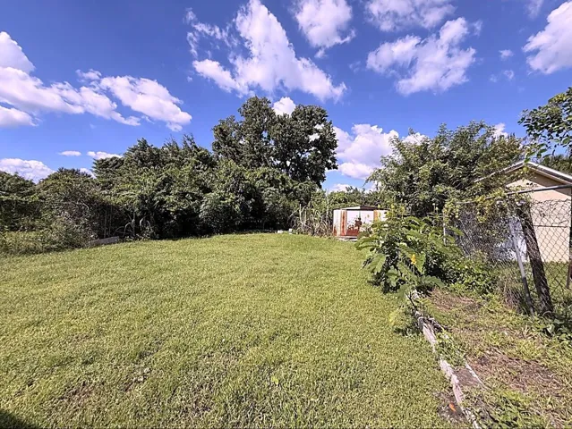 LARGE FENCED IN BACKYARD