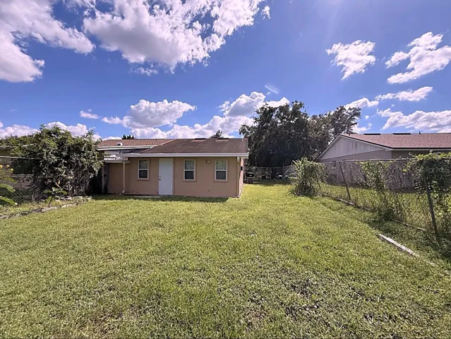 LARGE FENCED IN BACKYARD