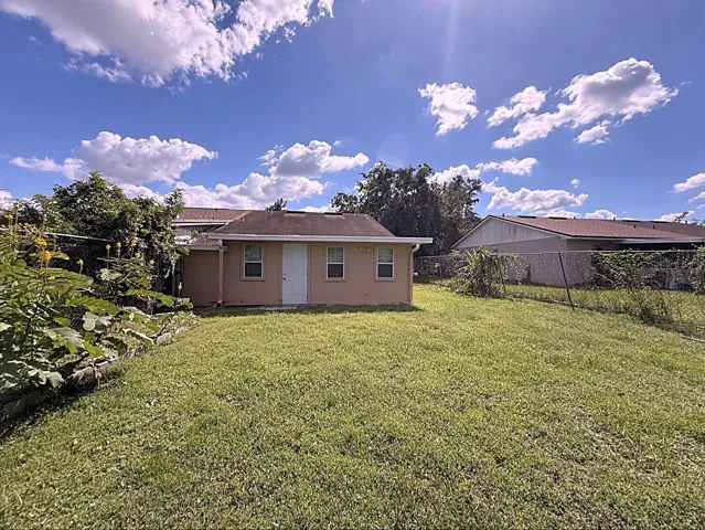 LARGE FENCED IN BACKYARD