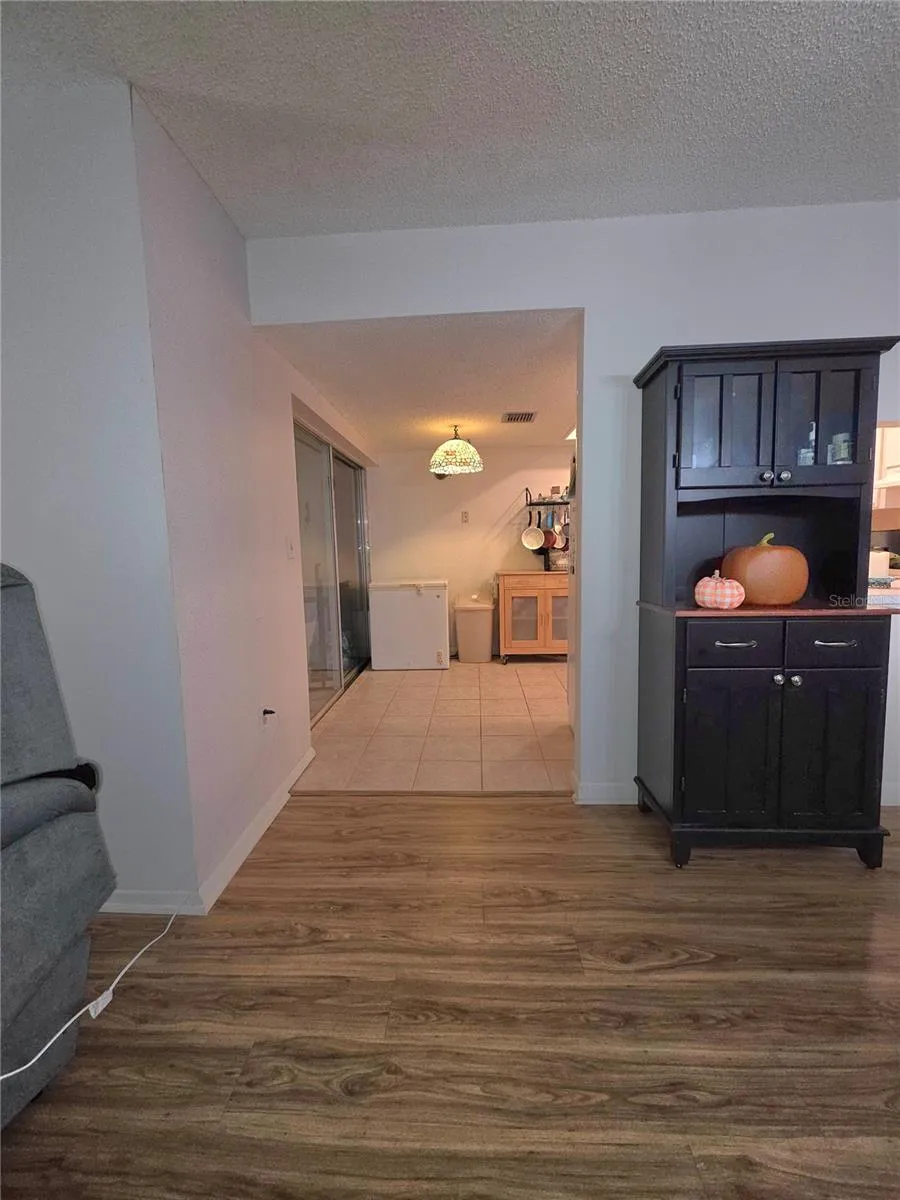 Dining room looking into eat in kitchen.