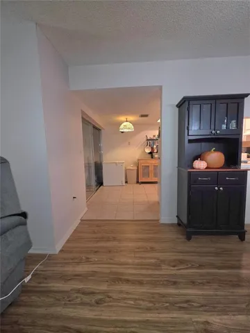 Dining room looking into eat in kitchen.