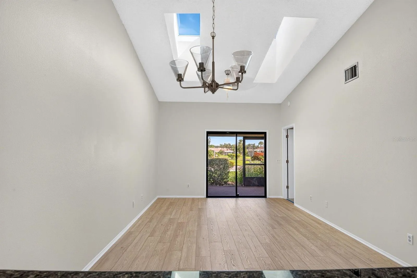 Living and Dining area wide open with skylights