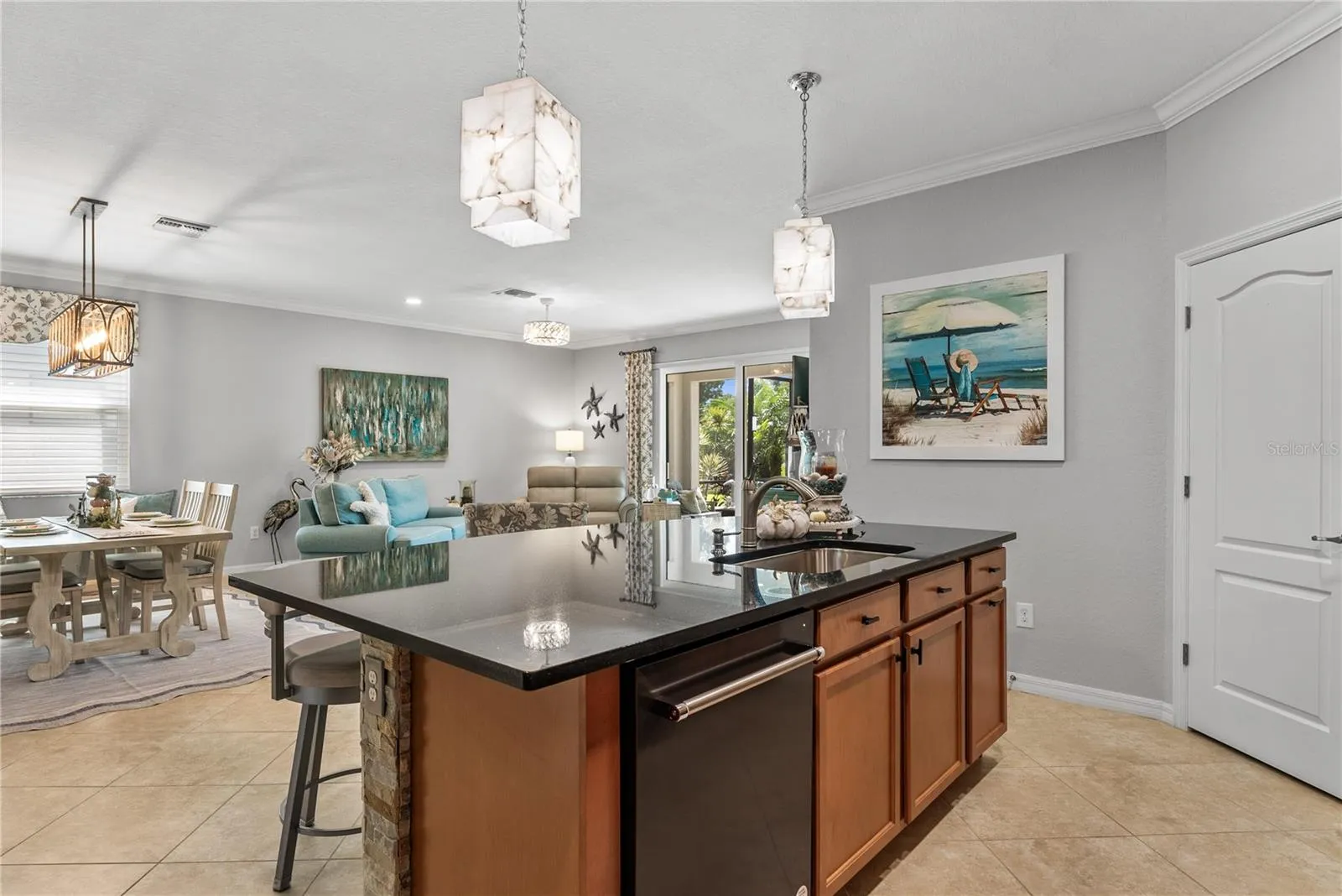 Facing dining and living area from inside kitchen area