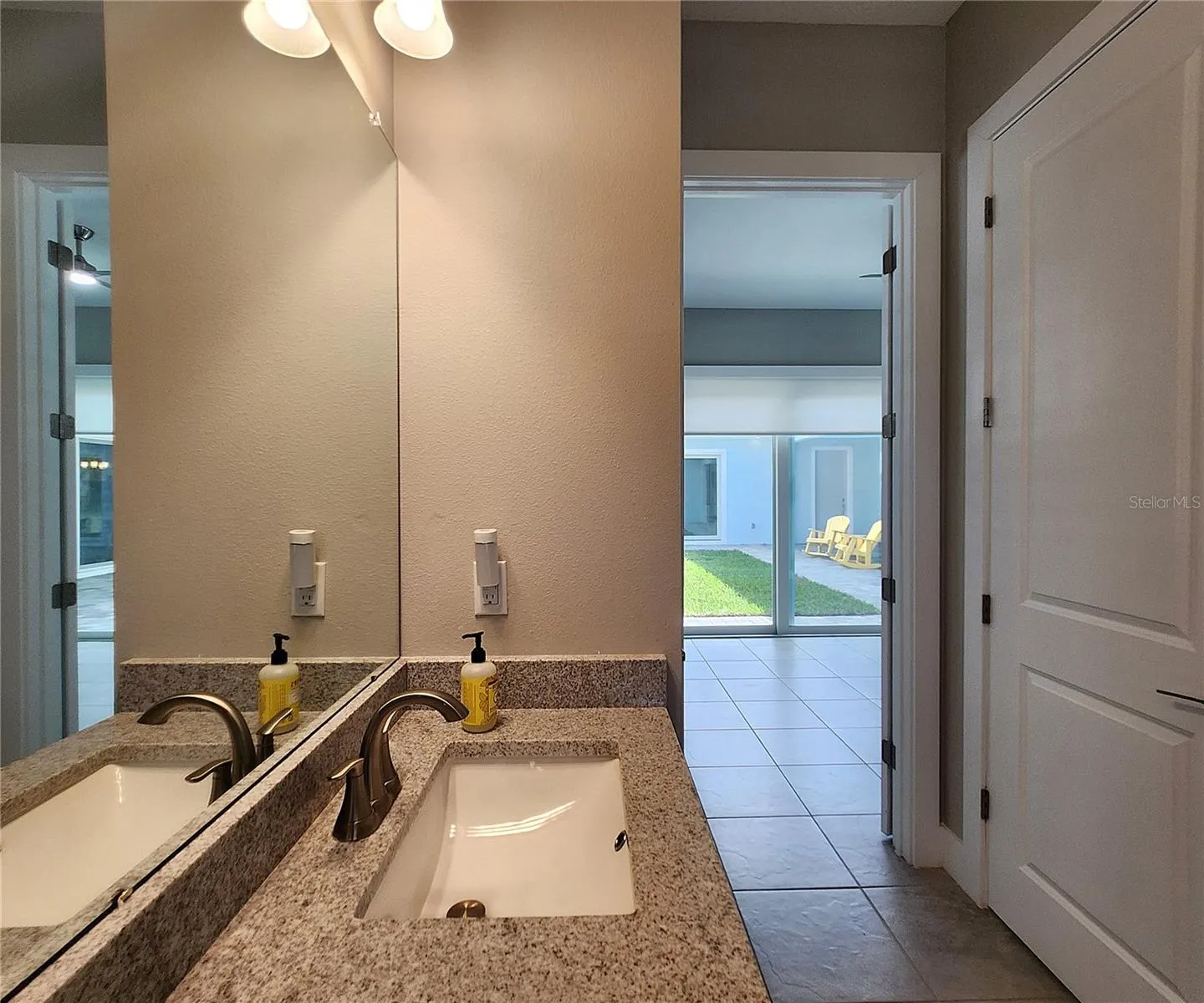 Guest House measures approximately 20x23, includes 1 bedroom, 1 full bathroom, living room, impact glass sliders with remote controlled shades.