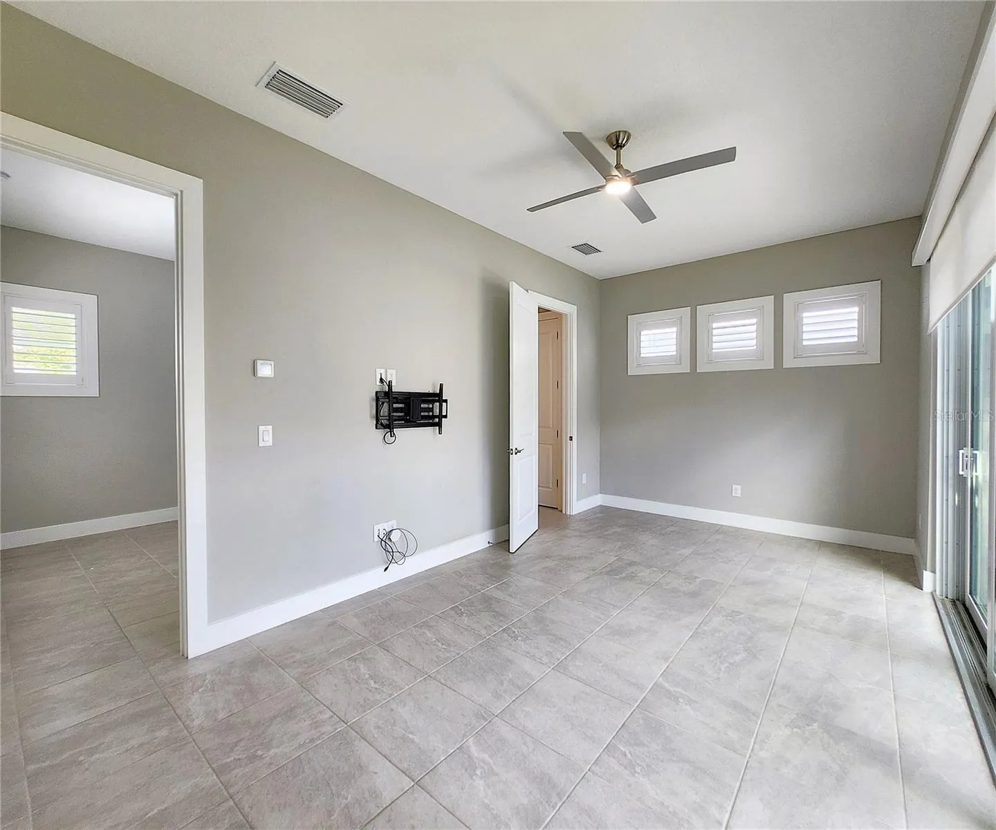 Guest House measures approximately 20x23, includes 1 bedroom, 1 full bathroom, living room, impact glass sliders with remote controlled shades.