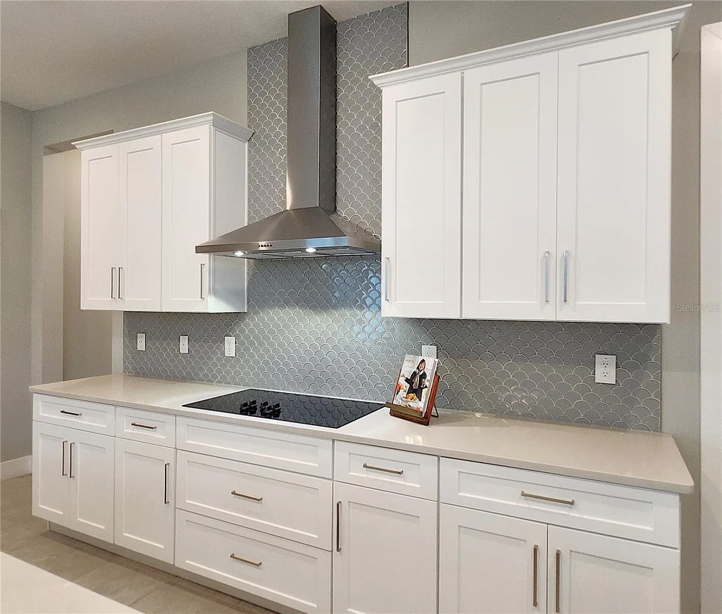 Quartz Countertops, Glass Backsplash, External Vent