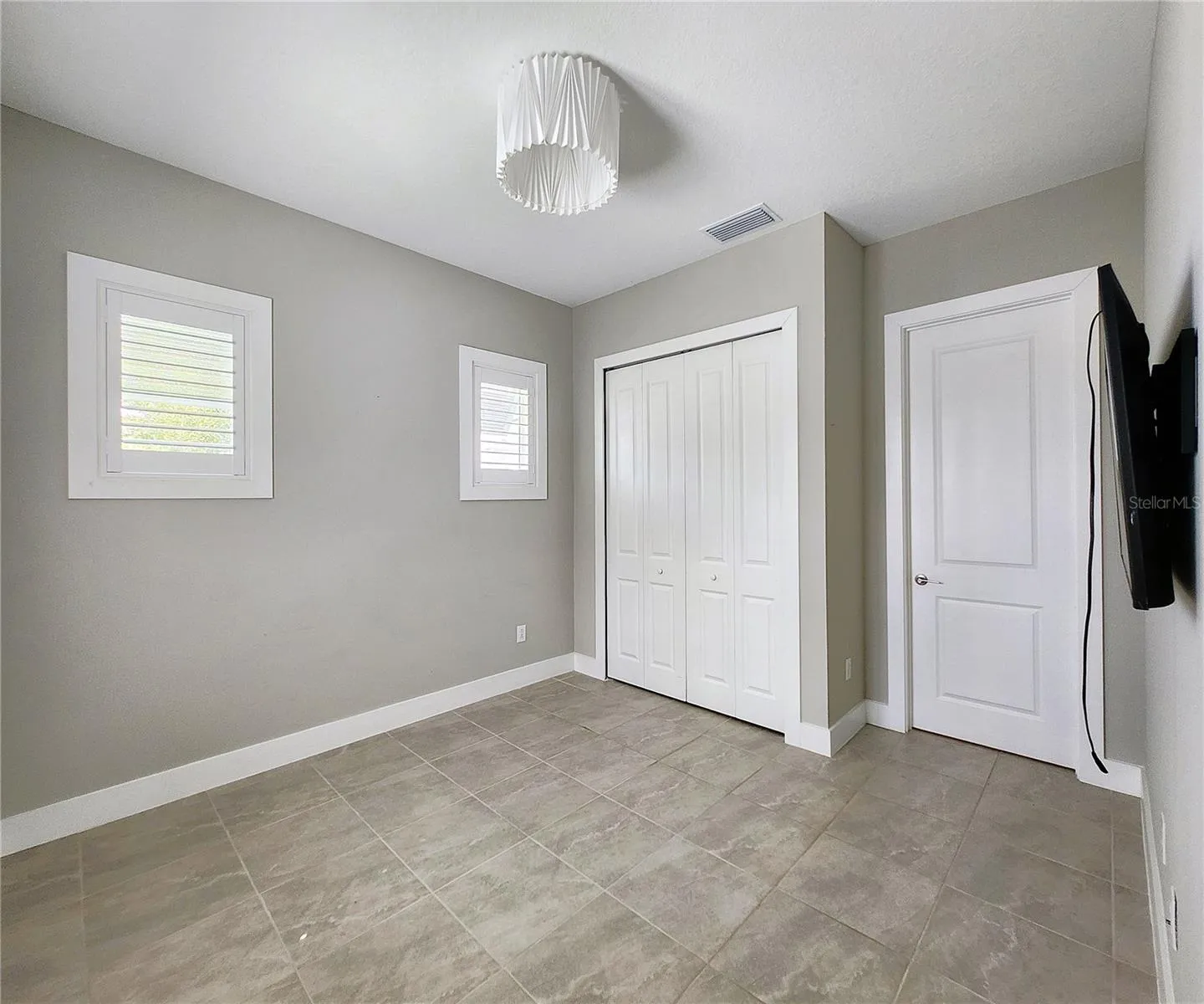 Guest House measures approximately 20x23, includes 1 bedroom, 1 full bathroom, living room, impact glass sliders with remote controlled shades.