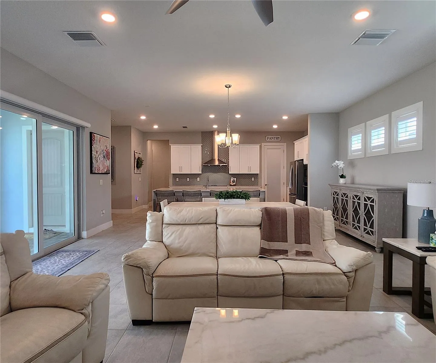 Main home: plantation shutters, remote controlled shade, large living room, dining area, large open kitchen, 3 bedrooms, 2 full bathrooms, 1 guest bathroom, interior laundry room
