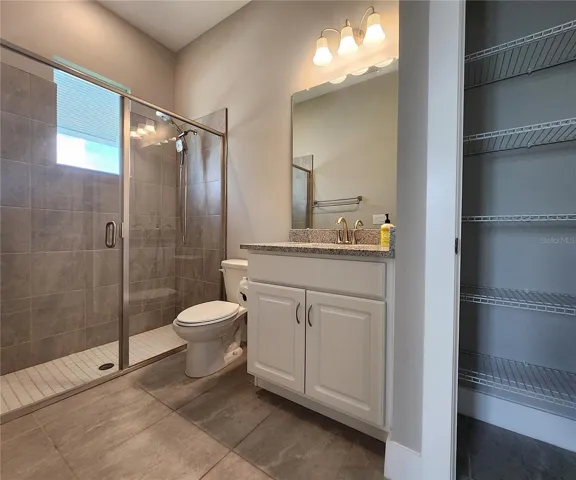 Guest House measures approximately 20x23, includes 1 bedroom, 1 full bathroom, living room, impact glass sliders with remote controlled shades.