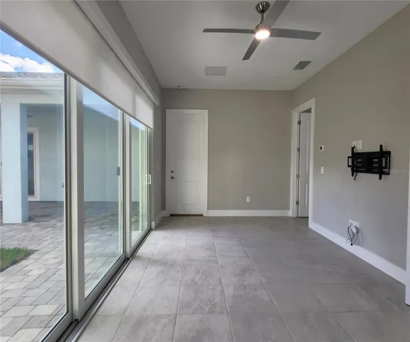 Guest House measures approximately 20x23, includes 1 bedroom, 1 full bathroom, living room, impact glass sliders with remote controlled shades.