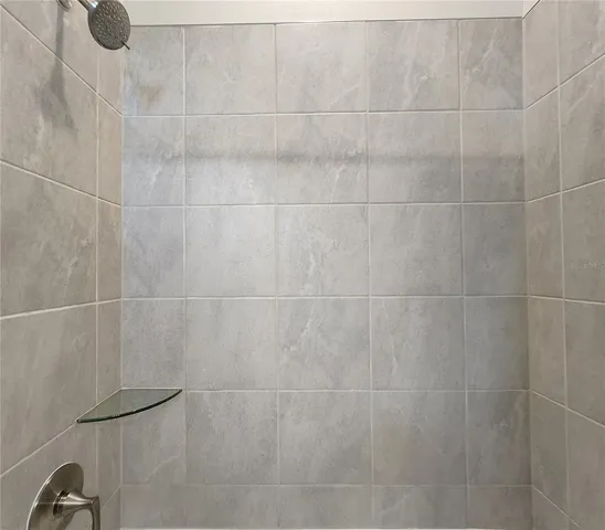 Jack-n-Jill Bathroom includes separate sink vanities, bathtub/shower combo