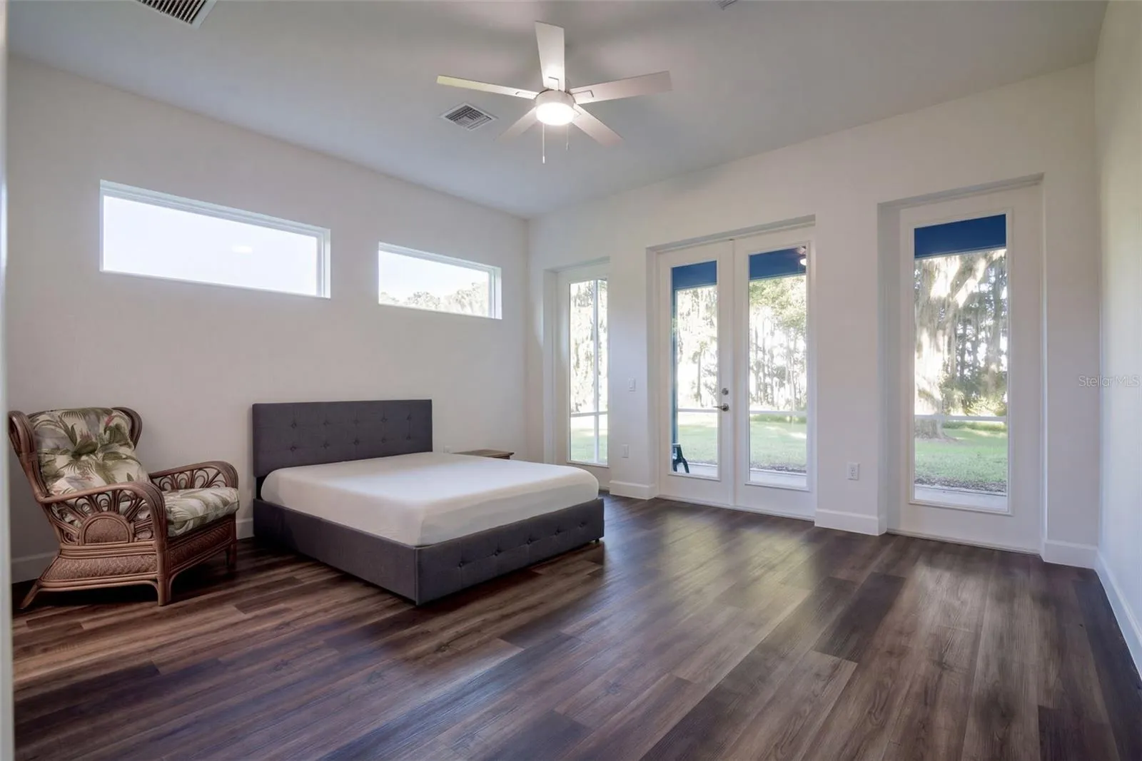 Primary suite with French doors straight onto the screened porch