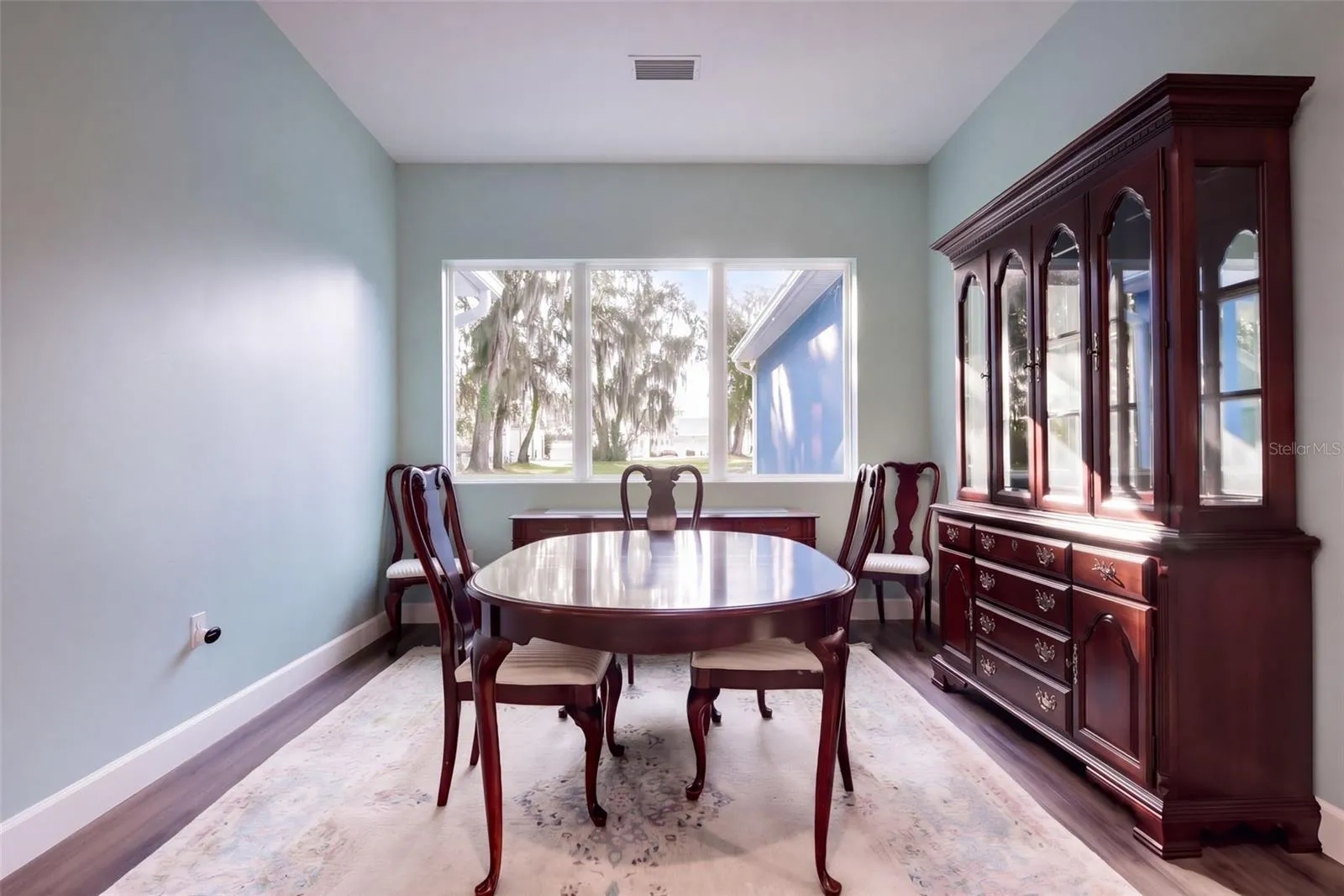 Separate dining room with a window to the oaks