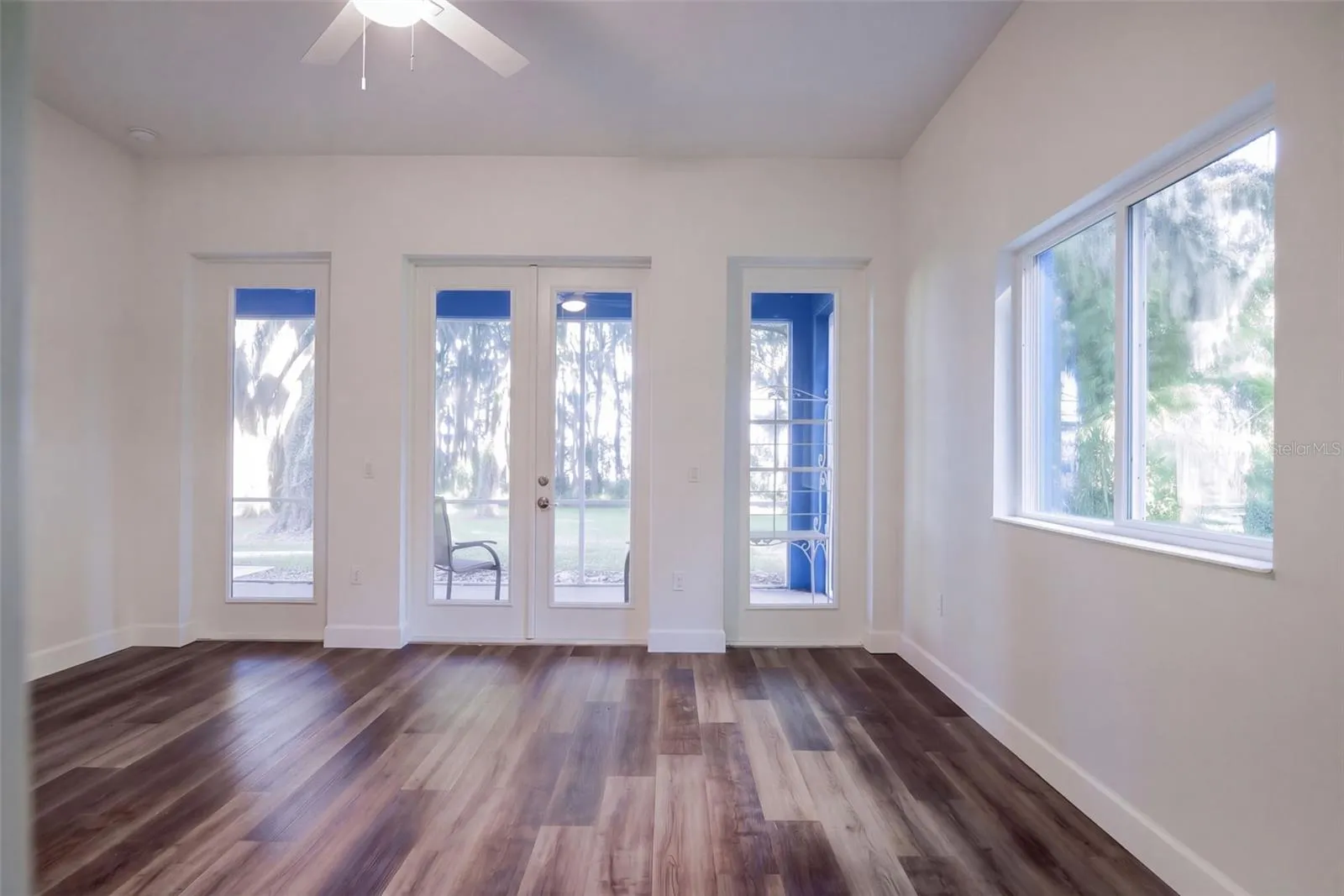 Second bedroom: 16x14 with ceiling fan and views to the backyard and lake