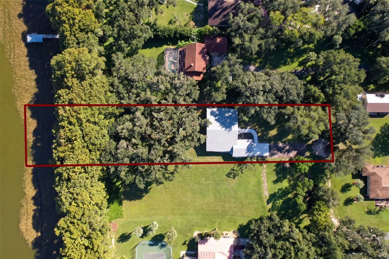 Aerial with estimated lot lines: 1.22 acres running to the water (lines approximate)