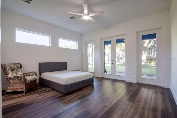 Primary suite with French doors straight onto the screened porch