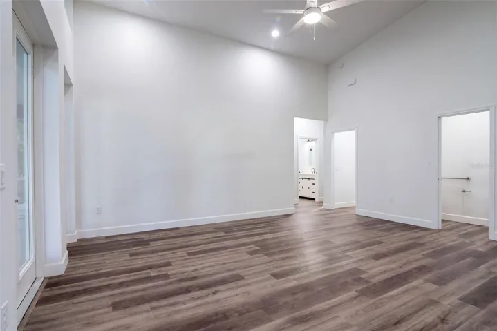 Split floor plan: primary suite on one side, guest rooms on the other