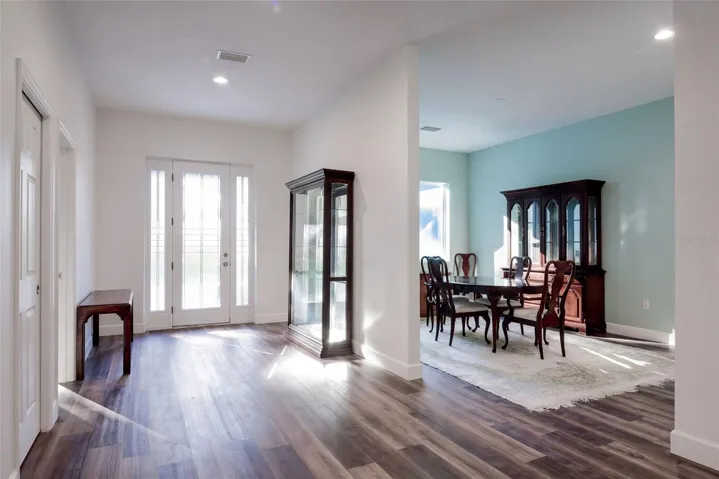Entry with built-in closet, dining room to the right