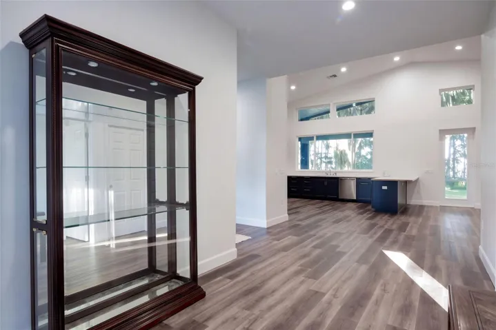 Foyer flows into the open kitchen and great room, with luxury vinyl plank throughout