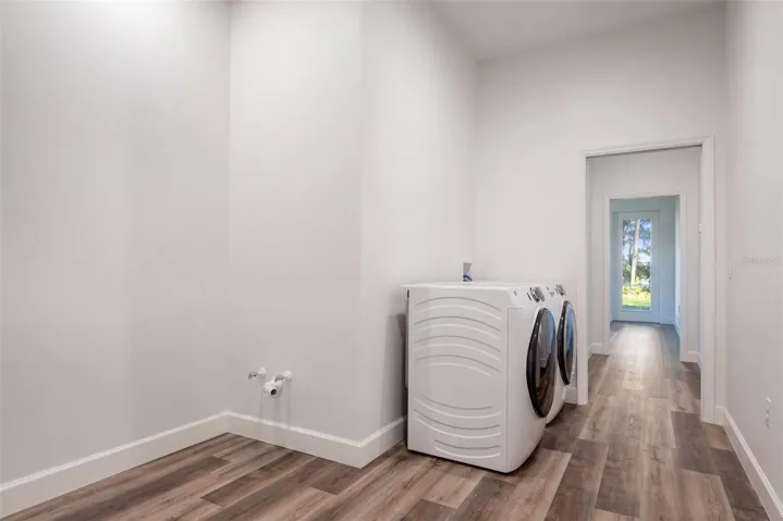 Indoor laundry room with washer and dryer included