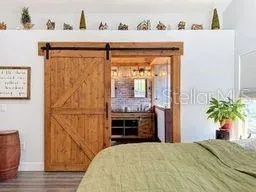Barn Door and Brick Accent Wall