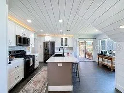Island Breakfast Bar With Crown Cabinet Lighting